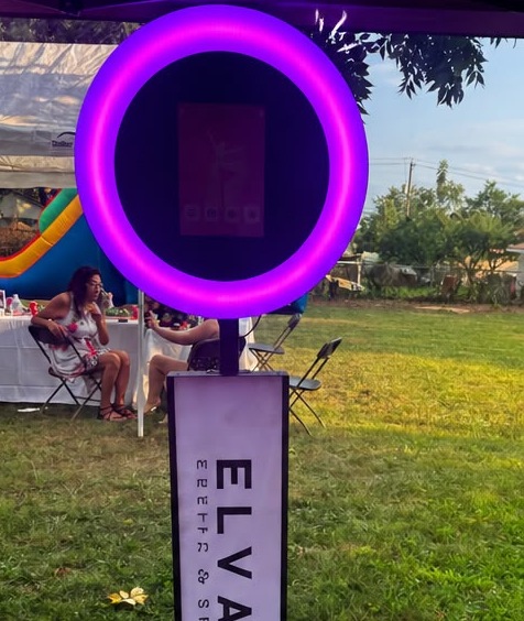 The Elevate photo booth with its glowing ring light